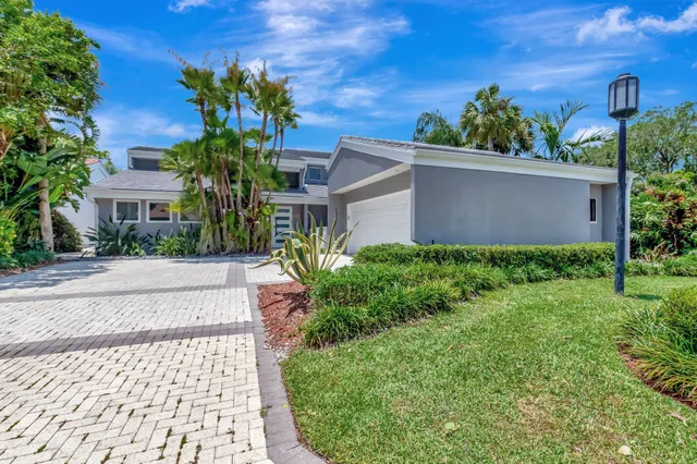 a view of a patio with table and chairs potted plants with wooden floor
