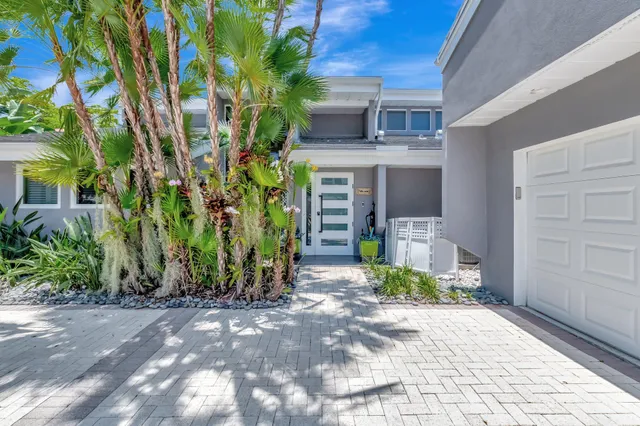 a view of a lake with houses in the back