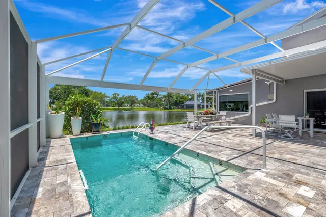 a view of a lake with houses in the back