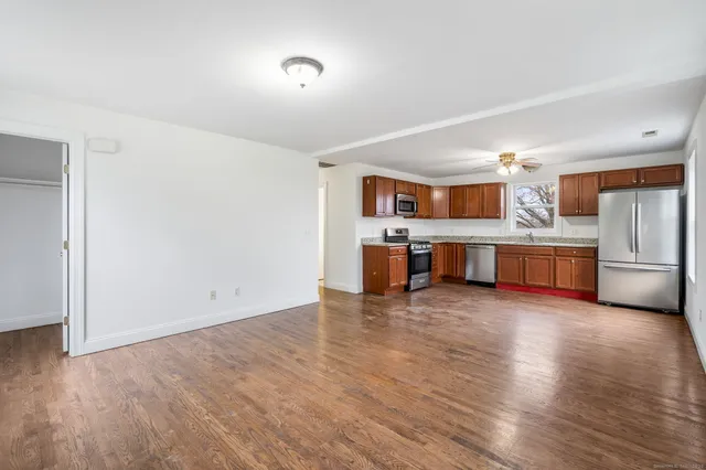 a view of kitchen with wooden floor