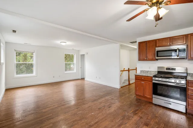 a view of kitchen with microwave and stove