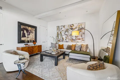 a balcony with furniture and a potted plant
