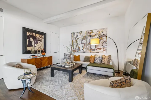 a balcony with furniture and a potted plant