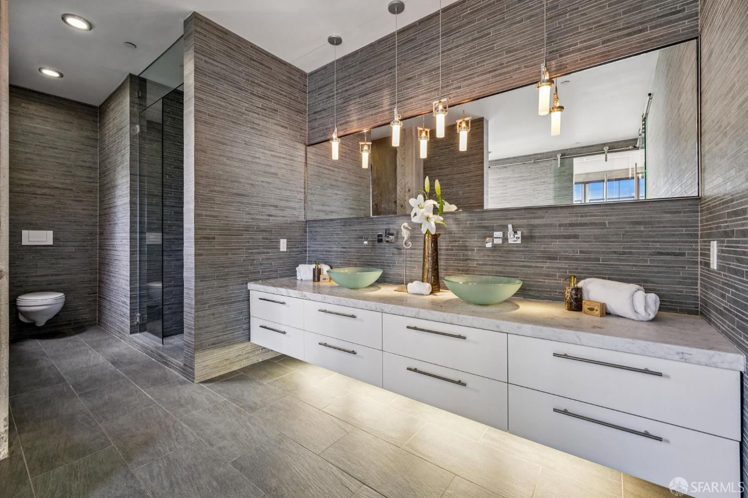 6 Mint Plaza, Unit 900A San Francisco, CA 94103 - Photo 34 of 55 a bathroom with a granite countertop sink mirror and toilet