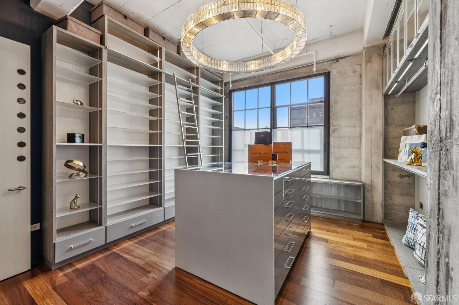 6 Mint Plaza, Unit 900A San Francisco, CA 94103 - Photo 38 of 55 a view of walk in closet and wooden floor