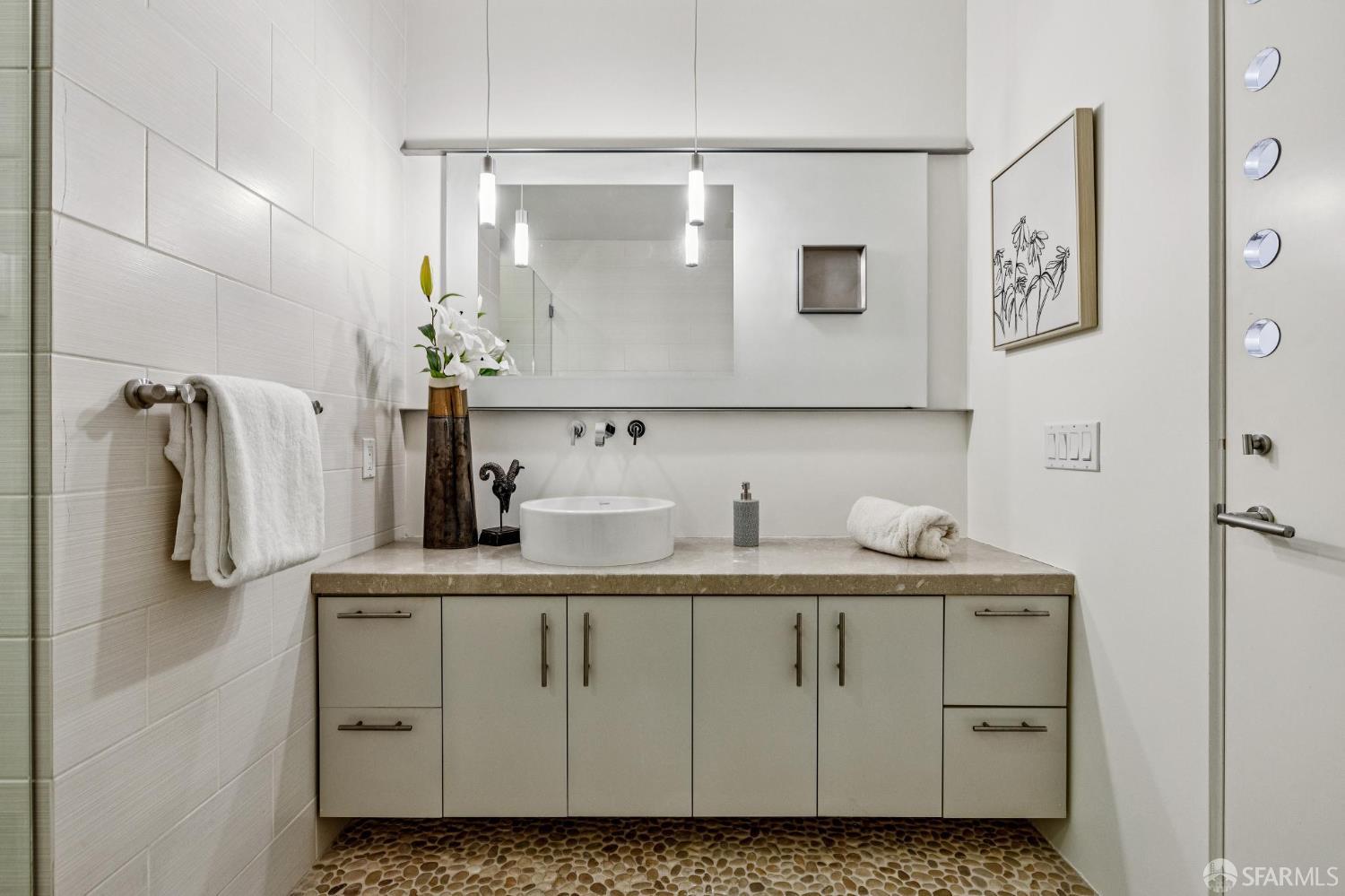 6 Mint Plaza, Unit 900A San Francisco, CA 94103 - Photo 40 of 55 a bathroom with a sink and a mirror