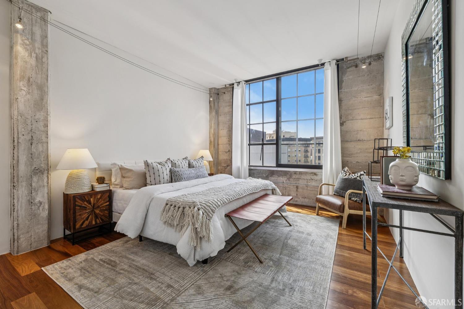 6 Mint Plaza, Unit 900A San Francisco, CA 94103 - Photo 42 of 55 a bedroom with a bed and large windows