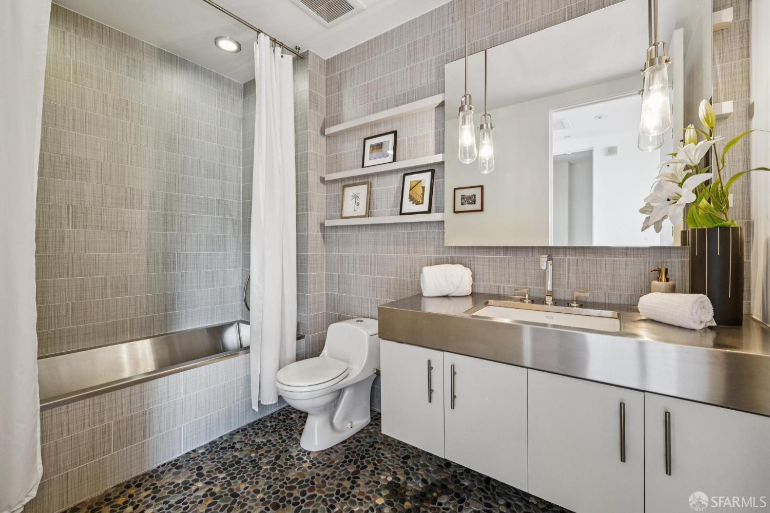 6 Mint Plaza, Unit 900A San Francisco, CA 94103 - Photo 44 of 55 a bathroom with a sink a toilet and shower