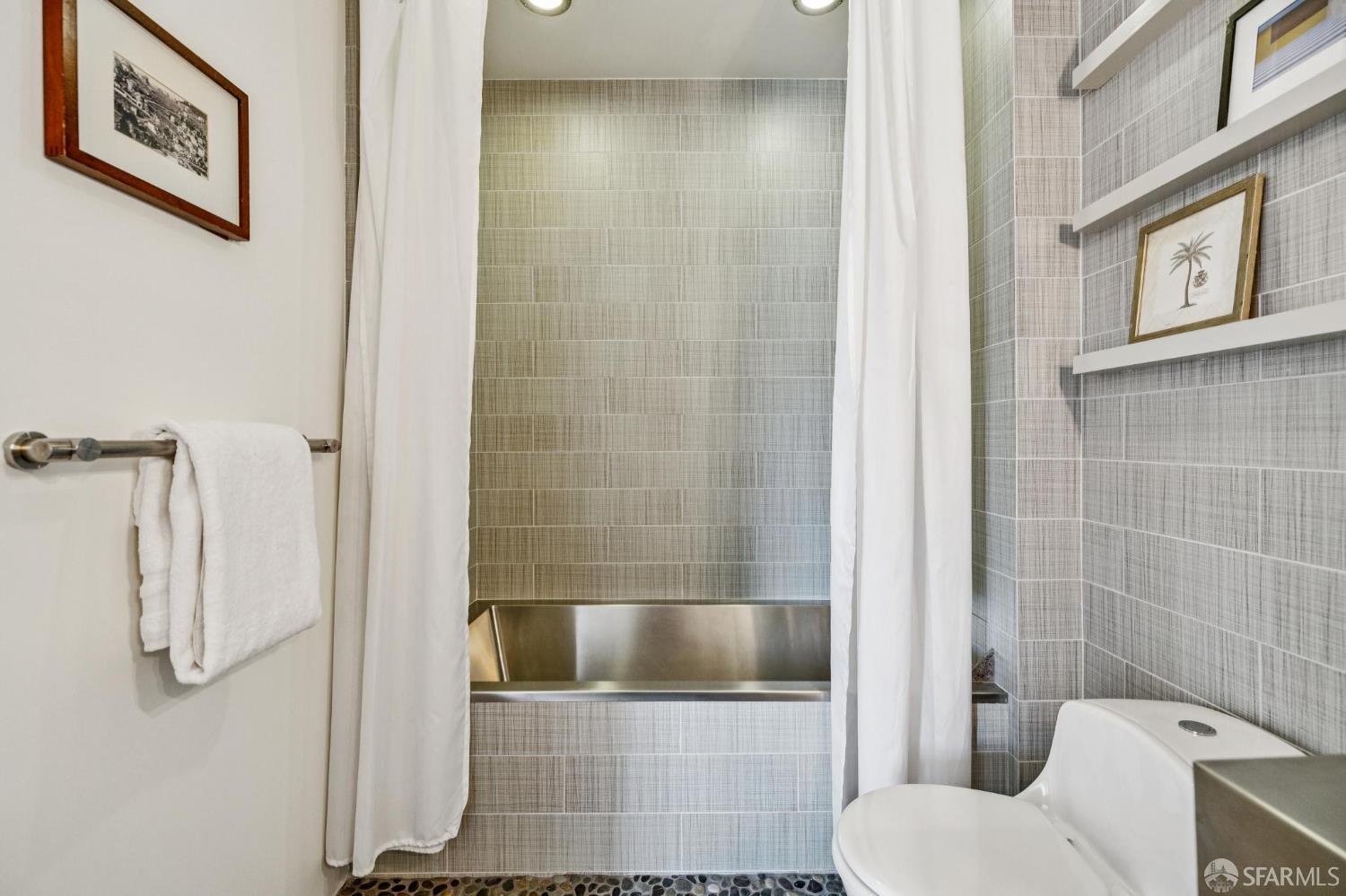 6 Mint Plaza, Unit 900A San Francisco, CA 94103 - Photo 45 of 55 a bathroom with a shower and toilet