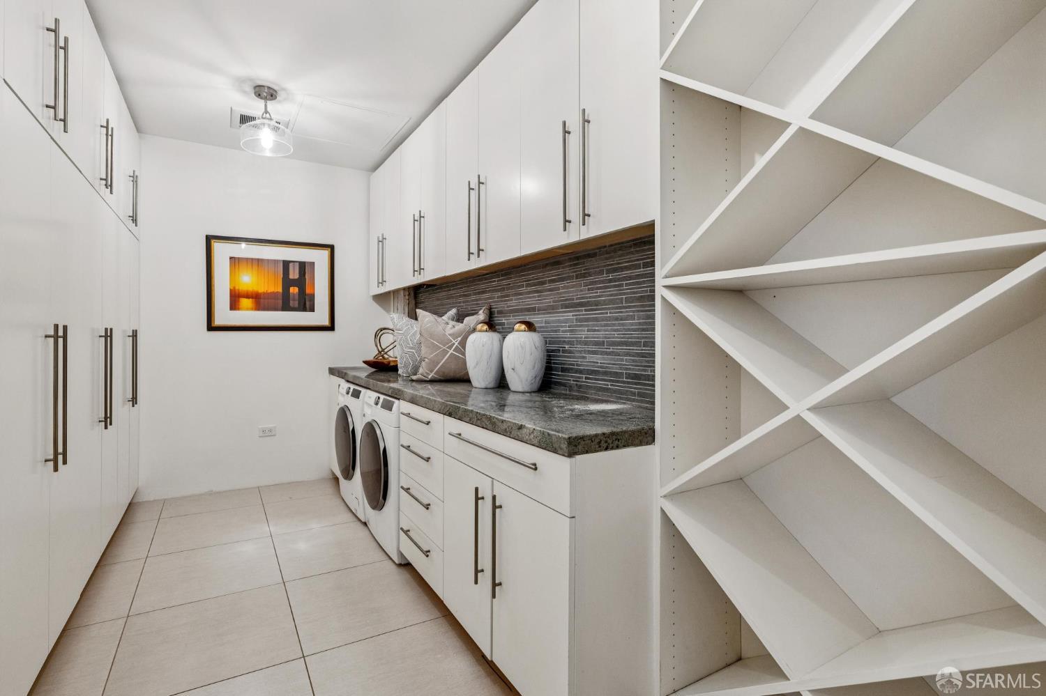 6 Mint Plaza, Unit 900A San Francisco, CA 94103 - Photo 47 of 55 a kitchen with stainless steel appliances granite countertop a sink and cabinets