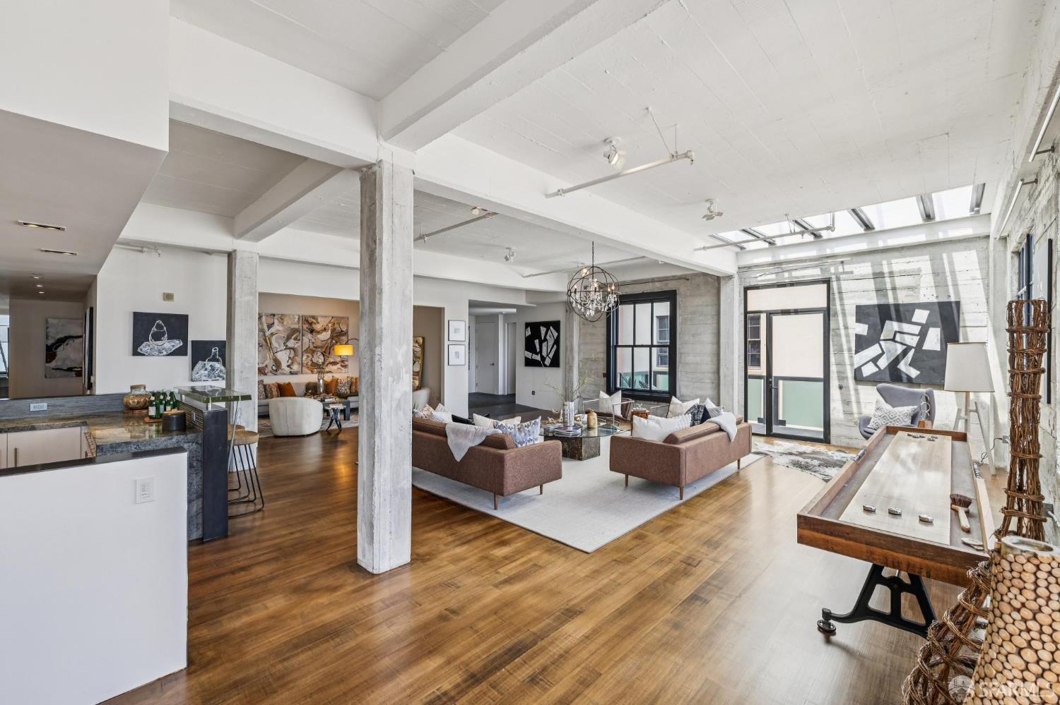 6 Mint Plaza, Unit 900A San Francisco, CA 94103 - Photo 9 of 55 a living room with furniture large window and wooden floor