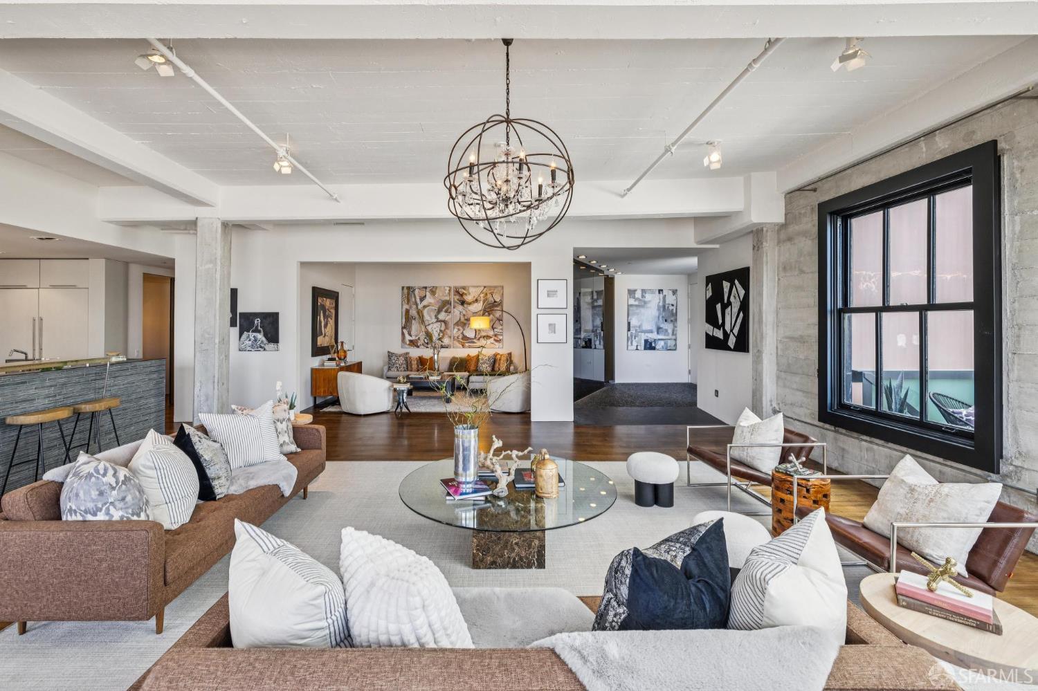 6 Mint Plaza, Unit 900A San Francisco, CA 94103 - Photo 10 of 55 a living room with furniture chandelier and a large window