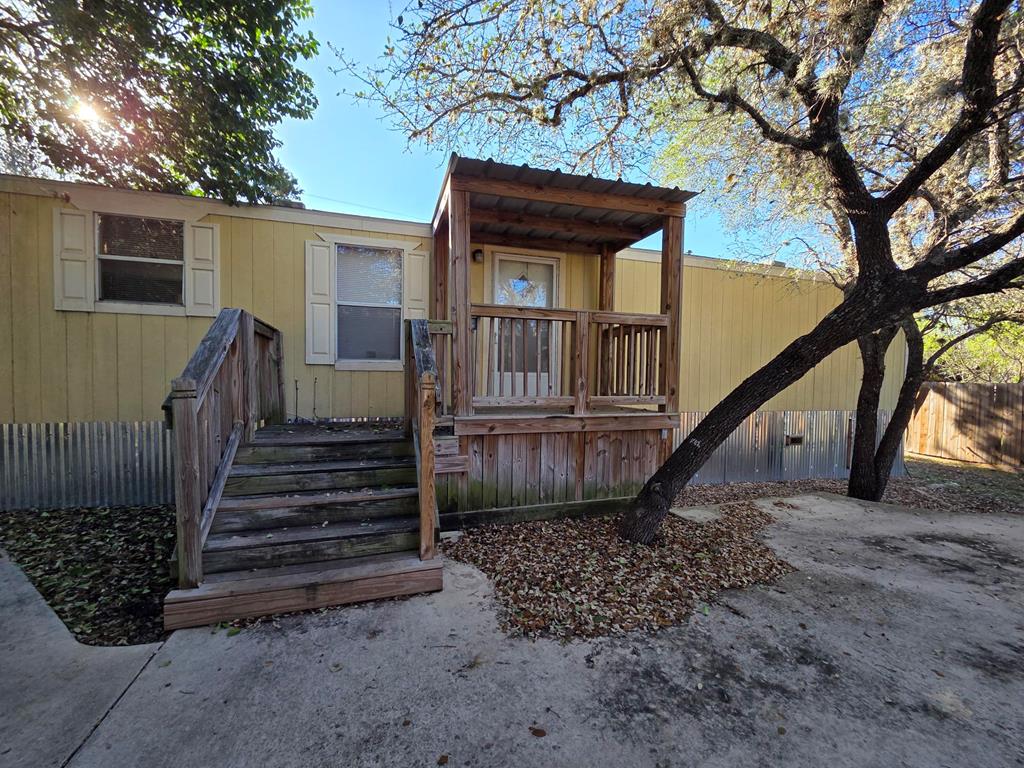 169 Fort Worth Street Bandera, TX 78003 - Photo 1 of 1 a view of a house with a small yard