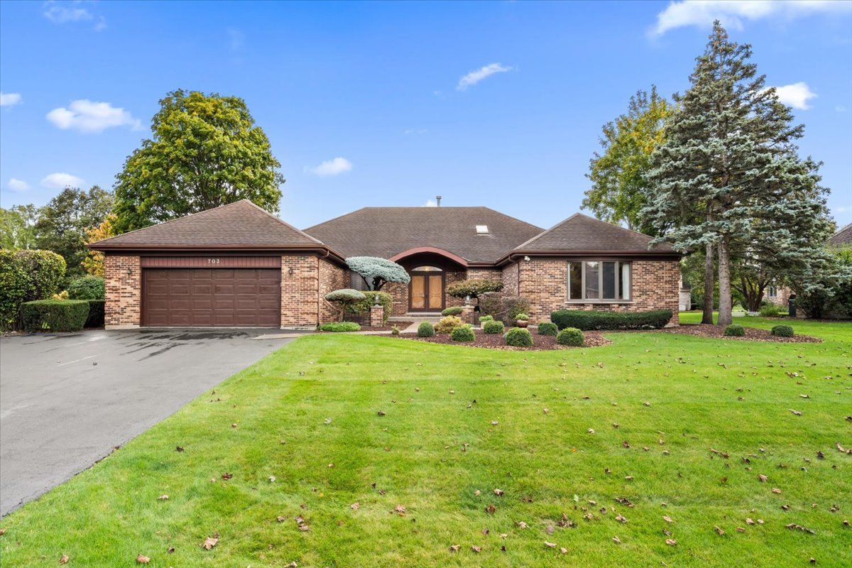 703 Newcastle Lane Prospect Heights, IL 60070 - Photo 2 of 45 a front view of a house with a garden and porch