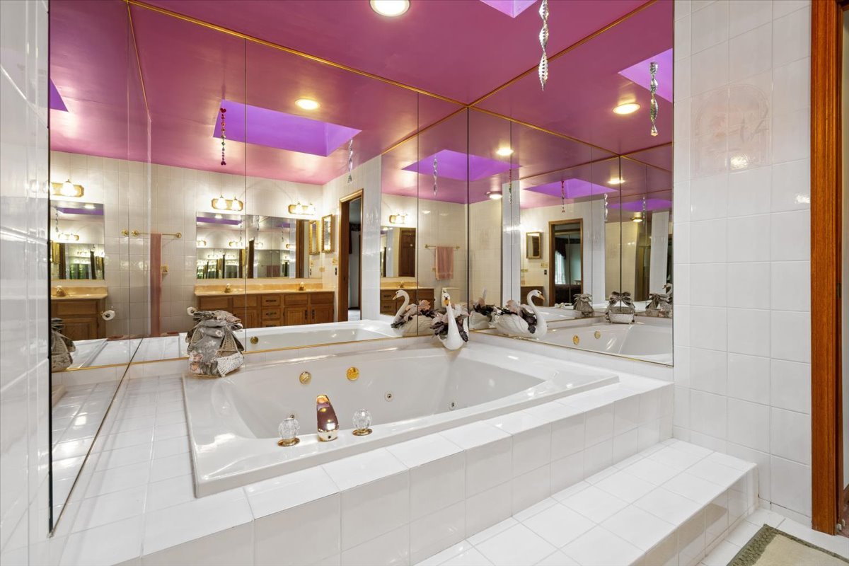 703 Newcastle Lane Prospect Heights, IL 60070 - Photo 26 of 45 a large hall with dining table and chairs