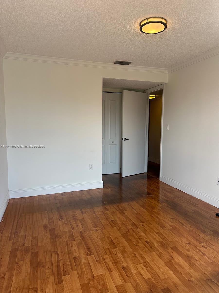 199 Southwest 12th Avenue, Unit 519B Miami, FL 33130 - Photo 14 of 25 a view of a livingroom with wooden floor