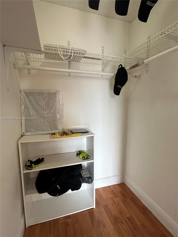 a bathroom with a sink mirror and toilet