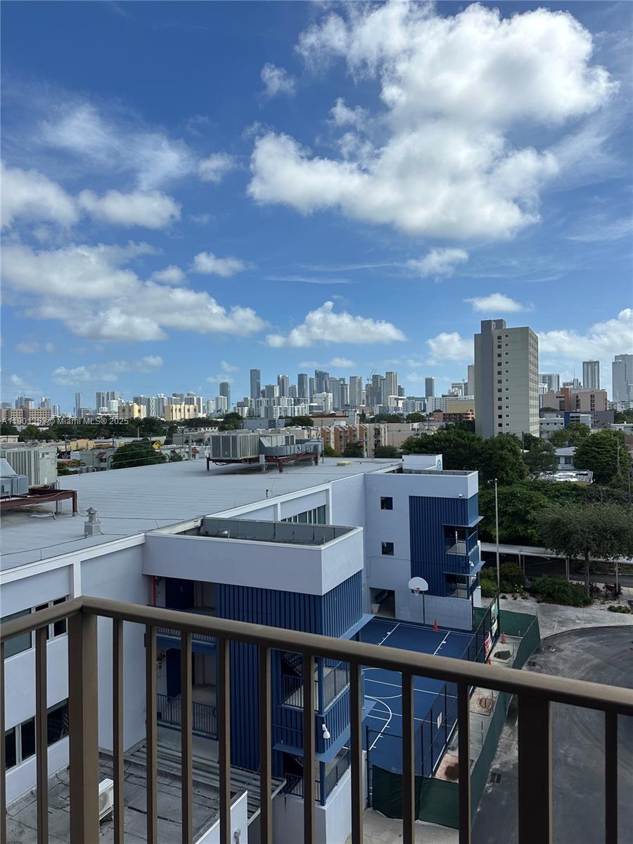 199 Southwest 12th Avenue, Unit 519B Miami, FL 33130 - Photo 2 of 25 a view of a balcony with table and chairs