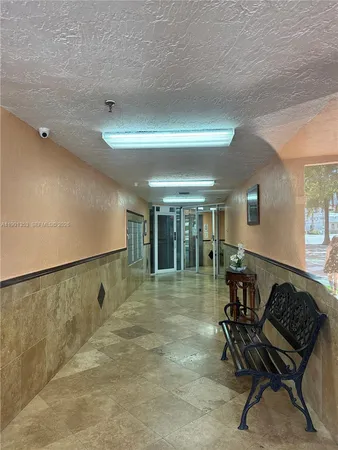 a outdoor view of a building with traffic signal lights