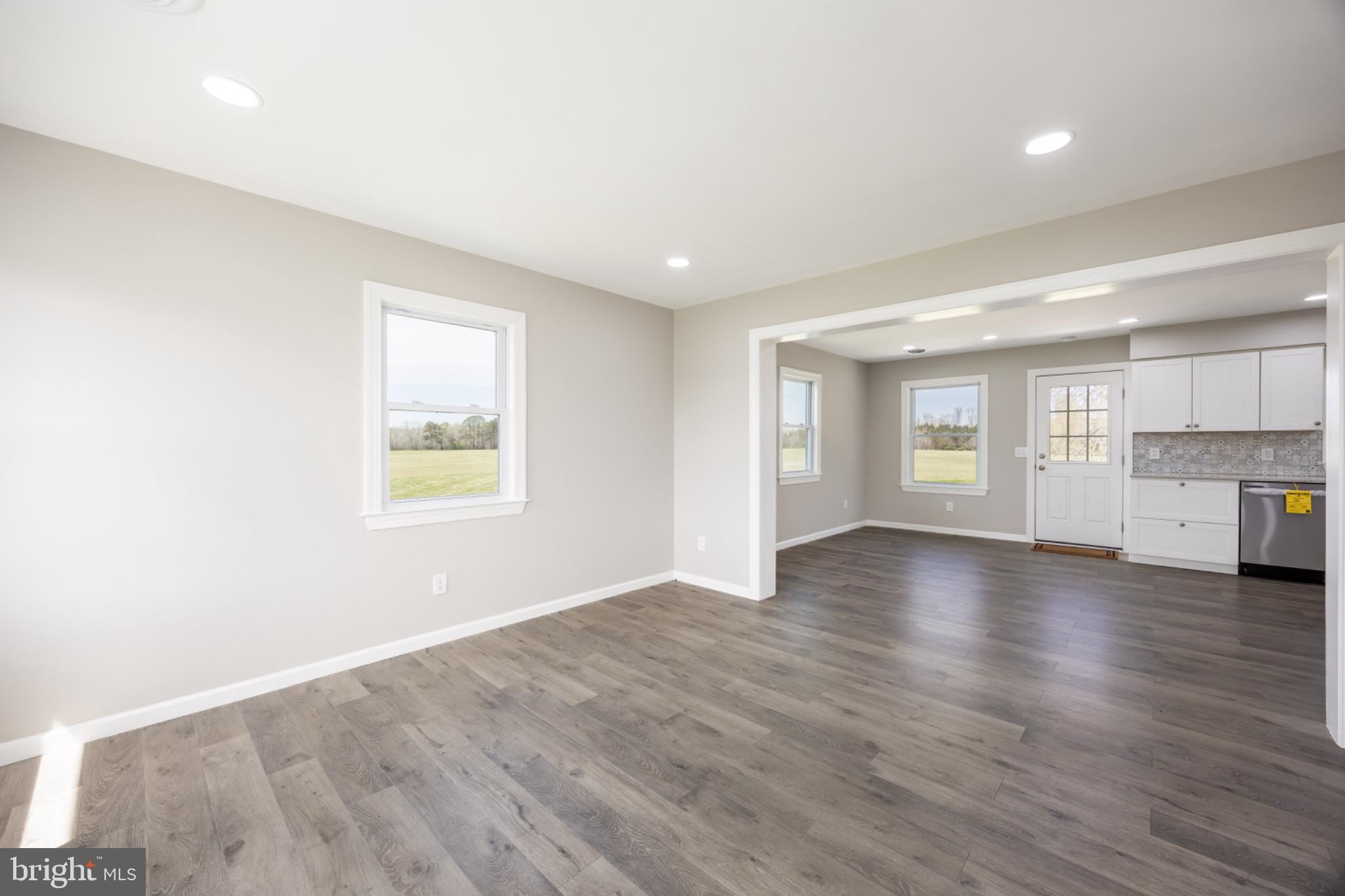 7121 Cedartown Road Snow Hill, MD 21863 - Photo 11 of 52 wooden floor in an empty room with a window