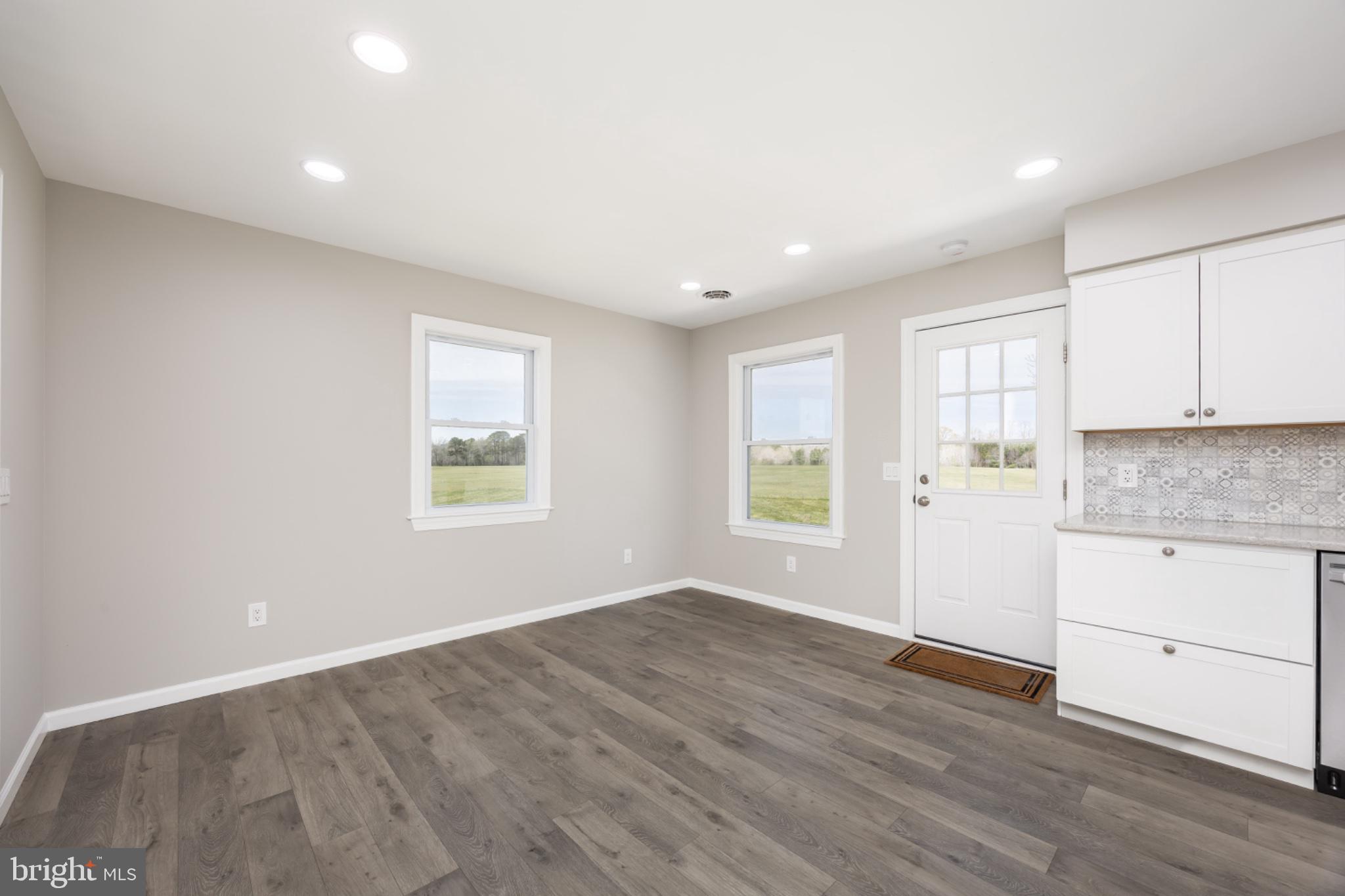 7121 Cedartown Road Snow Hill, MD 21863 - Photo 12 of 52 an empty room with wooden floor and window