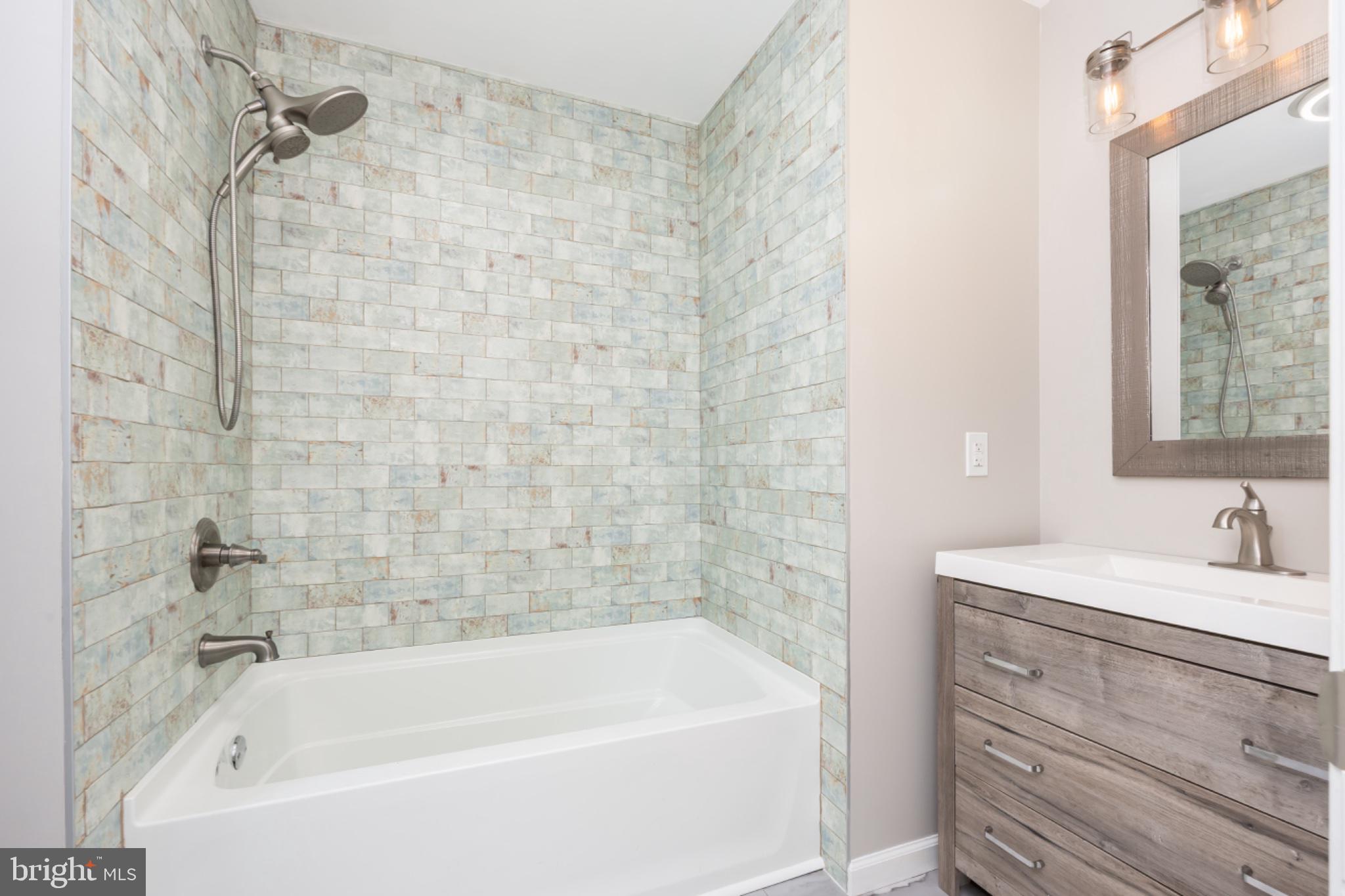 7121 Cedartown Road Snow Hill, MD 21863 - Photo 25 of 52 a bathroom with a sink and a bathtub