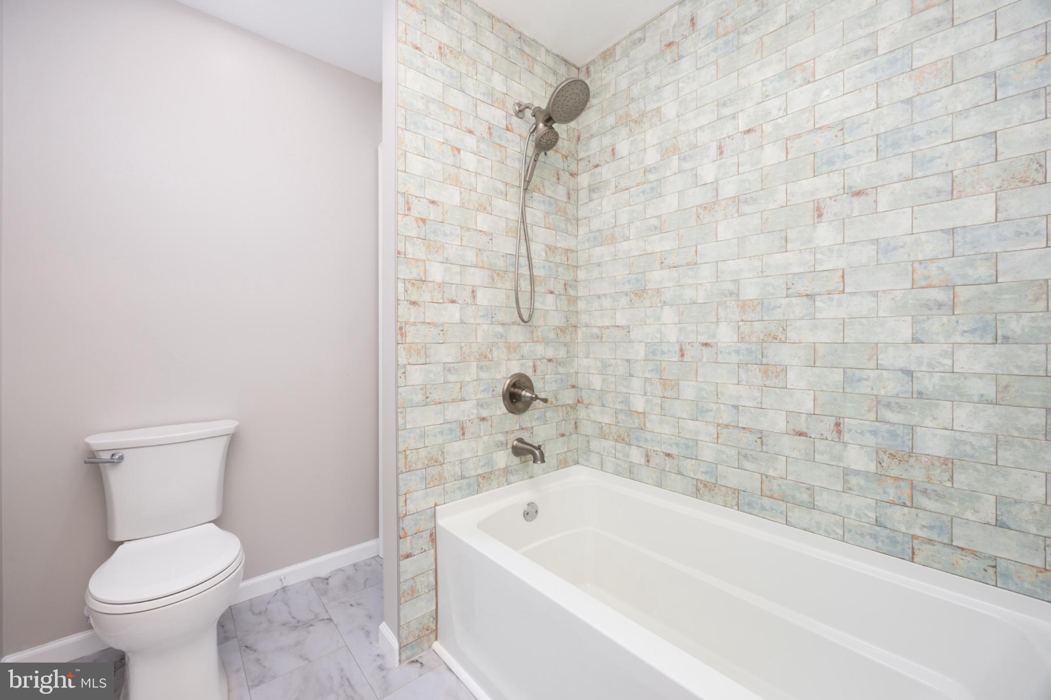 7121 Cedartown Road Snow Hill, MD 21863 - Photo 28 of 52 a bathroom with a toilet and a bathtub
