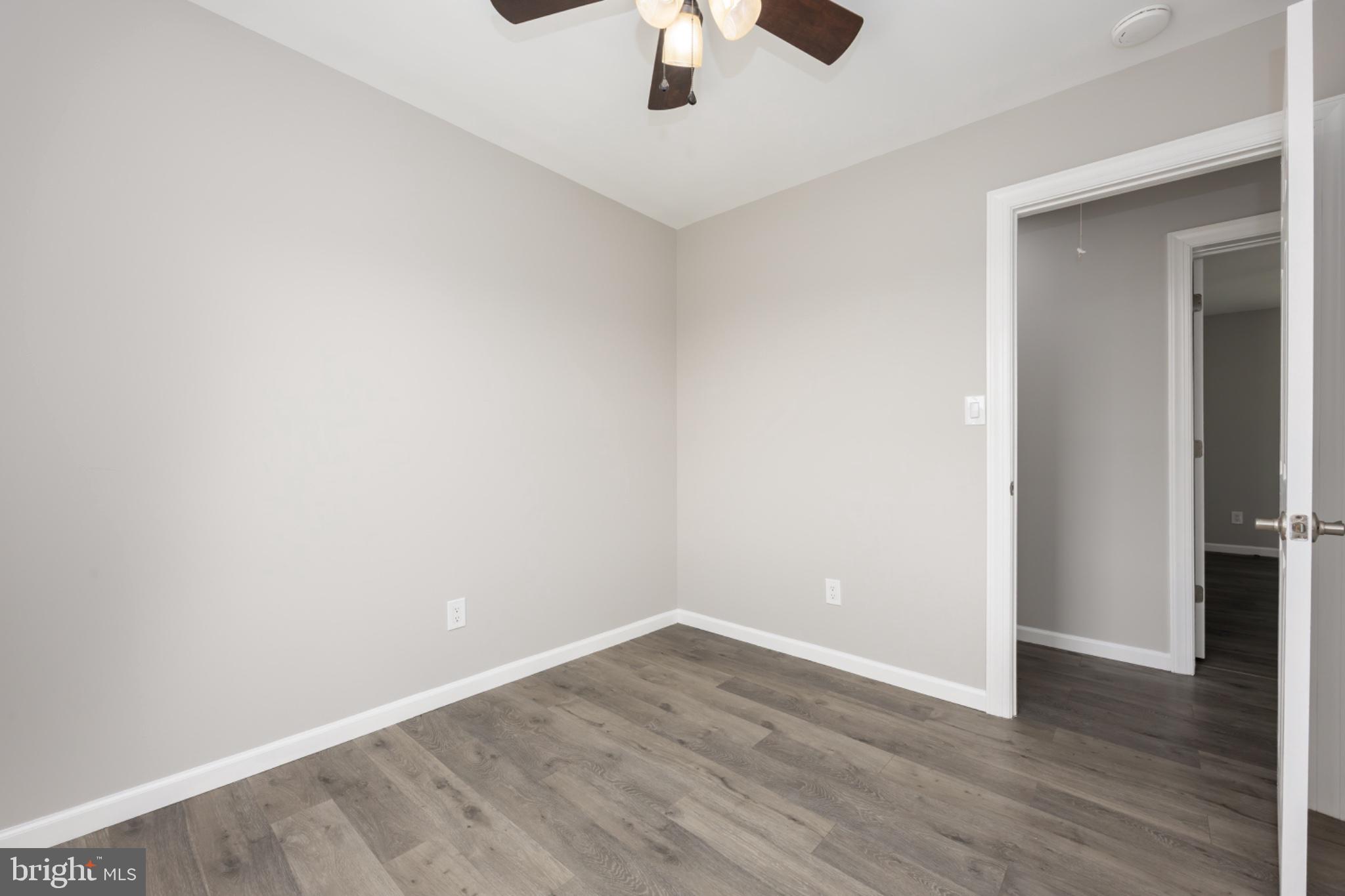 7121 Cedartown Road Snow Hill, MD 21863 - Photo 31 of 52 a view of an empty room with wooden floor