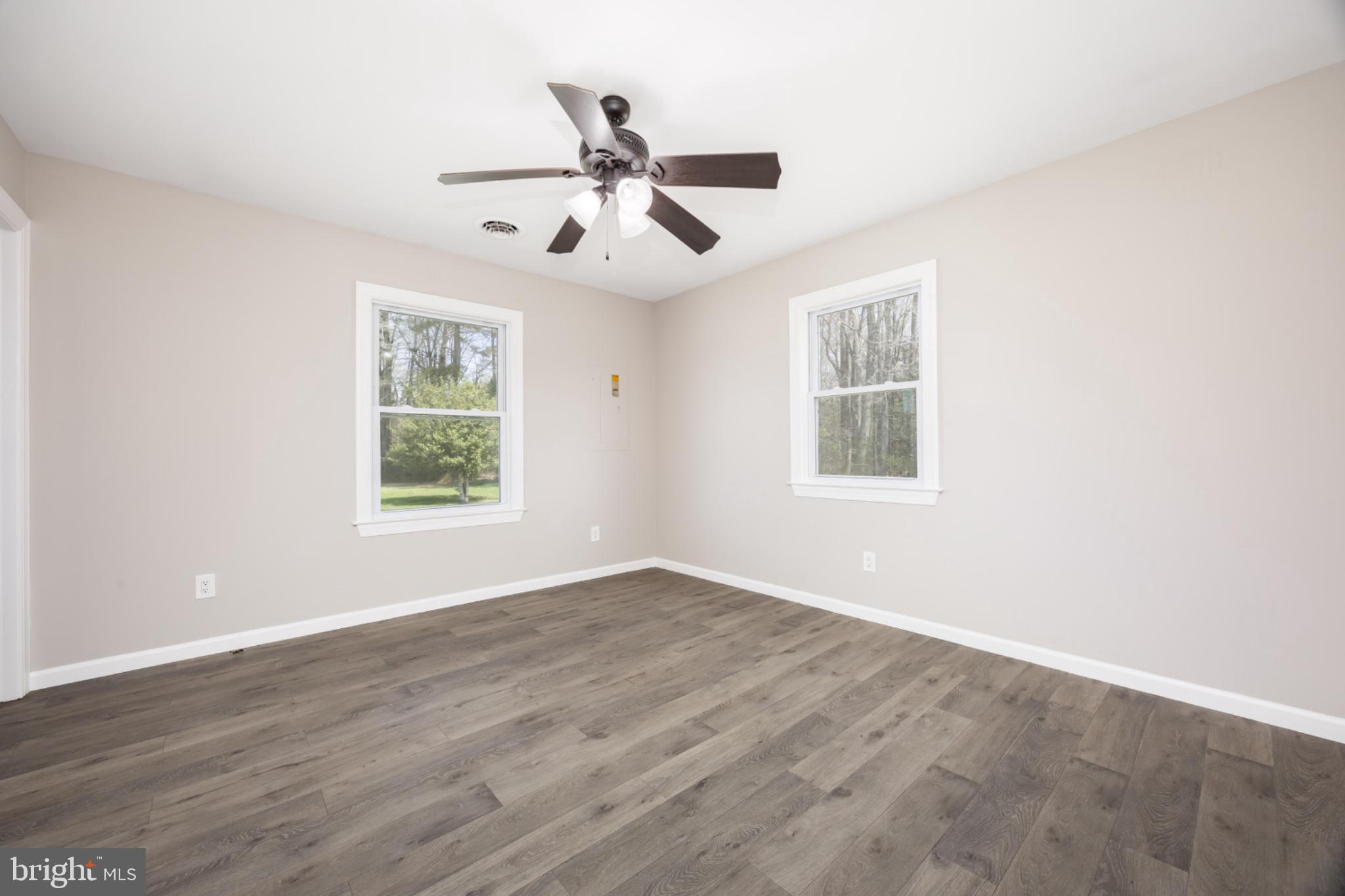 7121 Cedartown Road Snow Hill, MD 21863 - Photo 34 of 52 a view of an empty room with wooden floor and a window