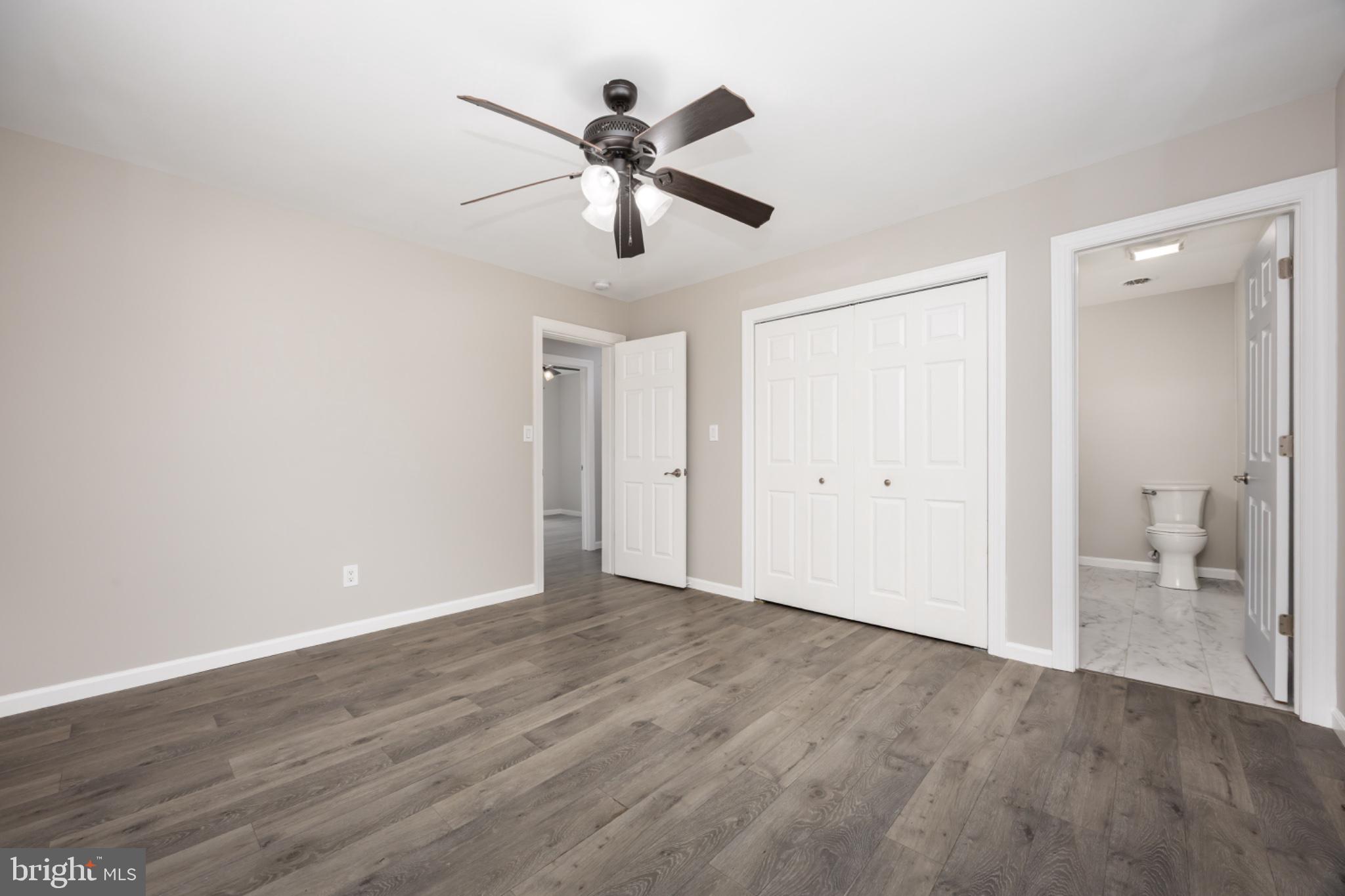 7121 Cedartown Road Snow Hill, MD 21863 - Photo 36 of 52 wooden floor in an empty room and a bathroom