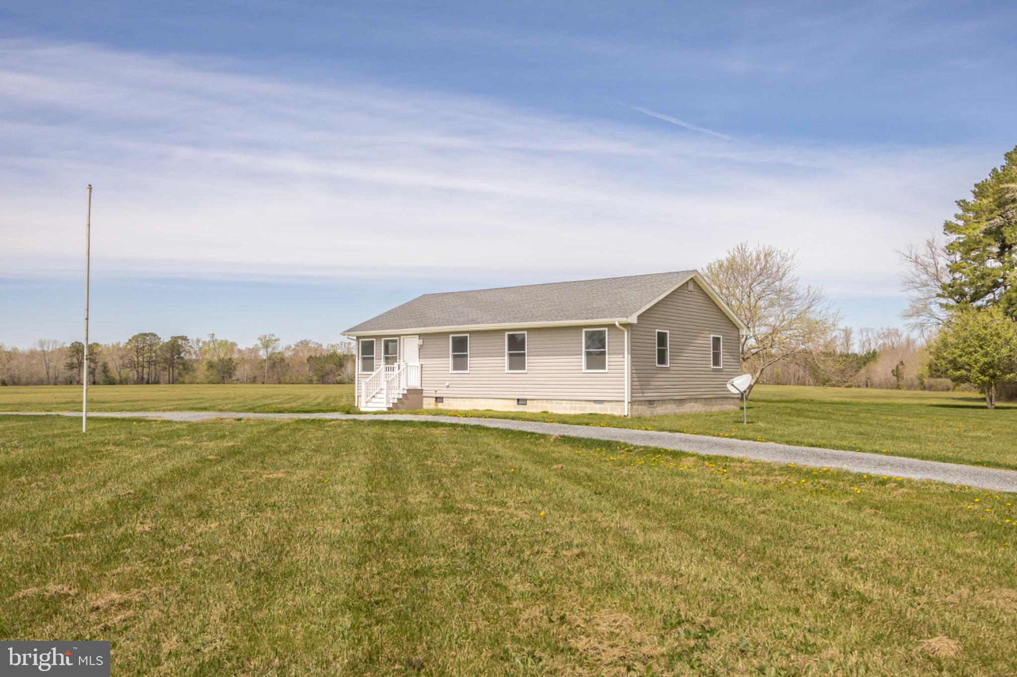 7121 Cedartown Road Snow Hill, MD 21863 - Photo 4 of 52 a front view of a house with a yard