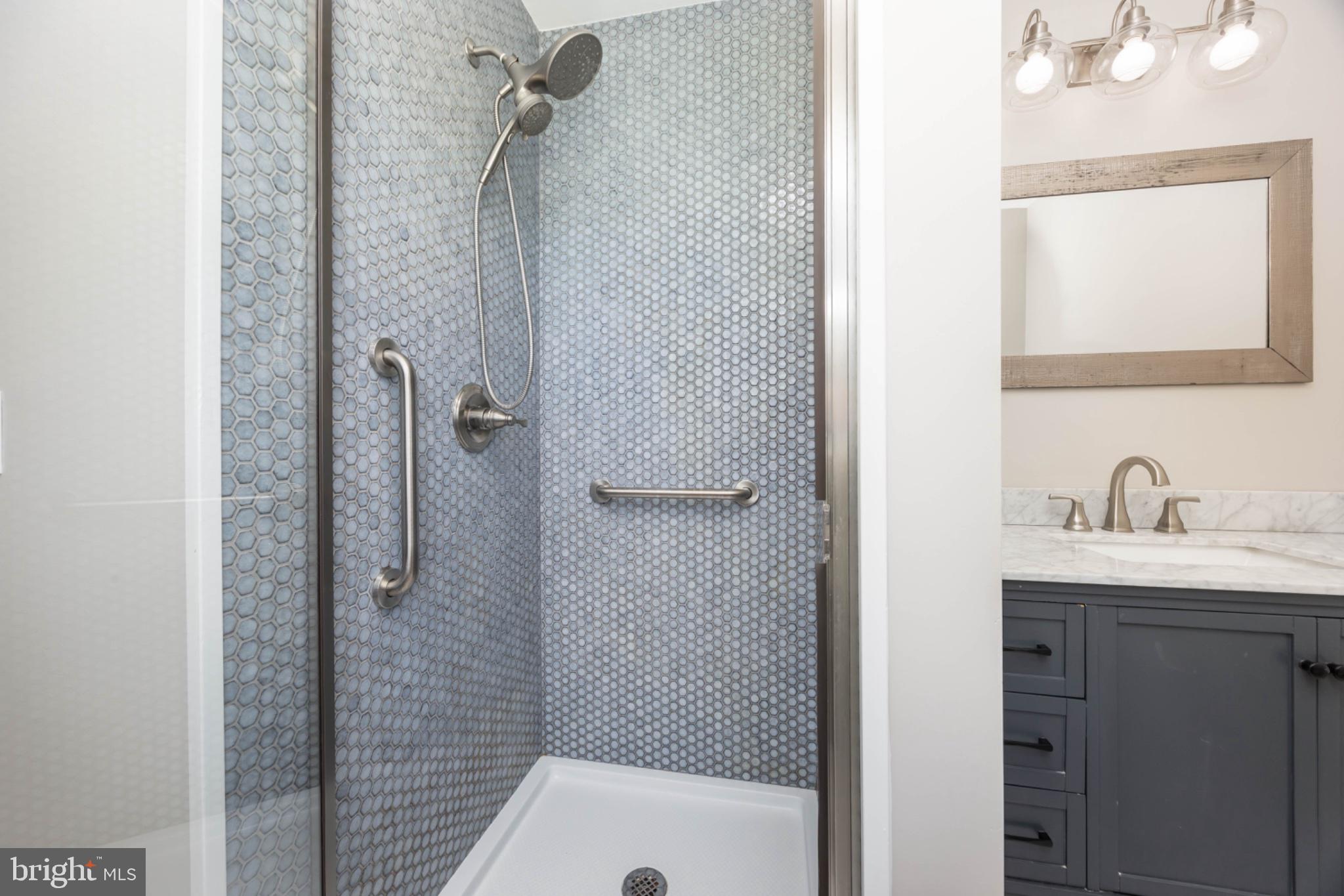 7121 Cedartown Road Snow Hill, MD 21863 - Photo 41 of 52 a bathroom with a granite countertop shower a sink and a mirror