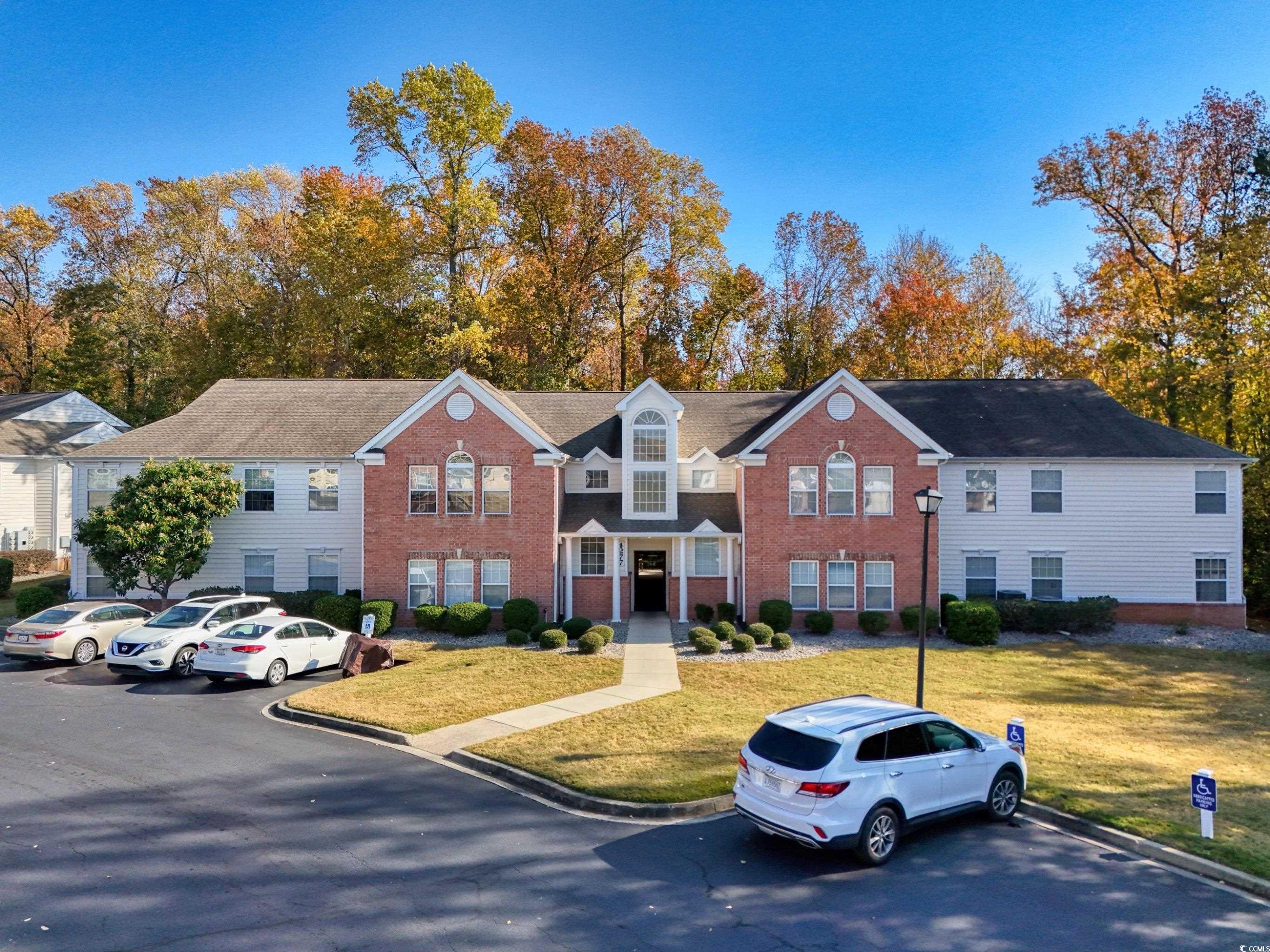 4277 Santolina Way, Unit D Murrells Inlet, SC 29576 - Photo 1 of 40 Traditional-style house featuring a front lawn and brick siding