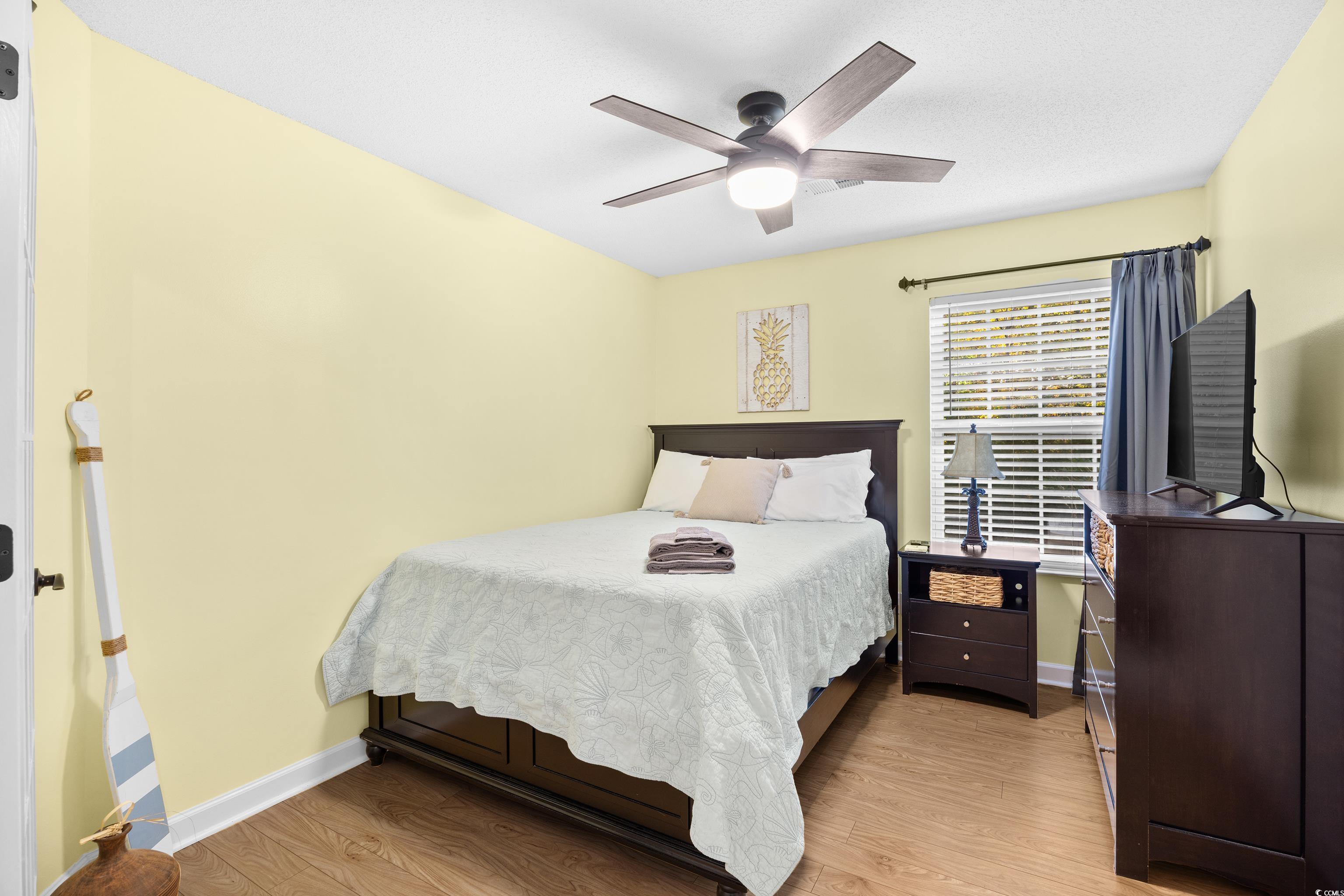 4277 Santolina Way, Unit D Murrells Inlet, SC 29576 - Photo 17 of 40 Bedroom featuring light wood-type flooring and ceiling fan