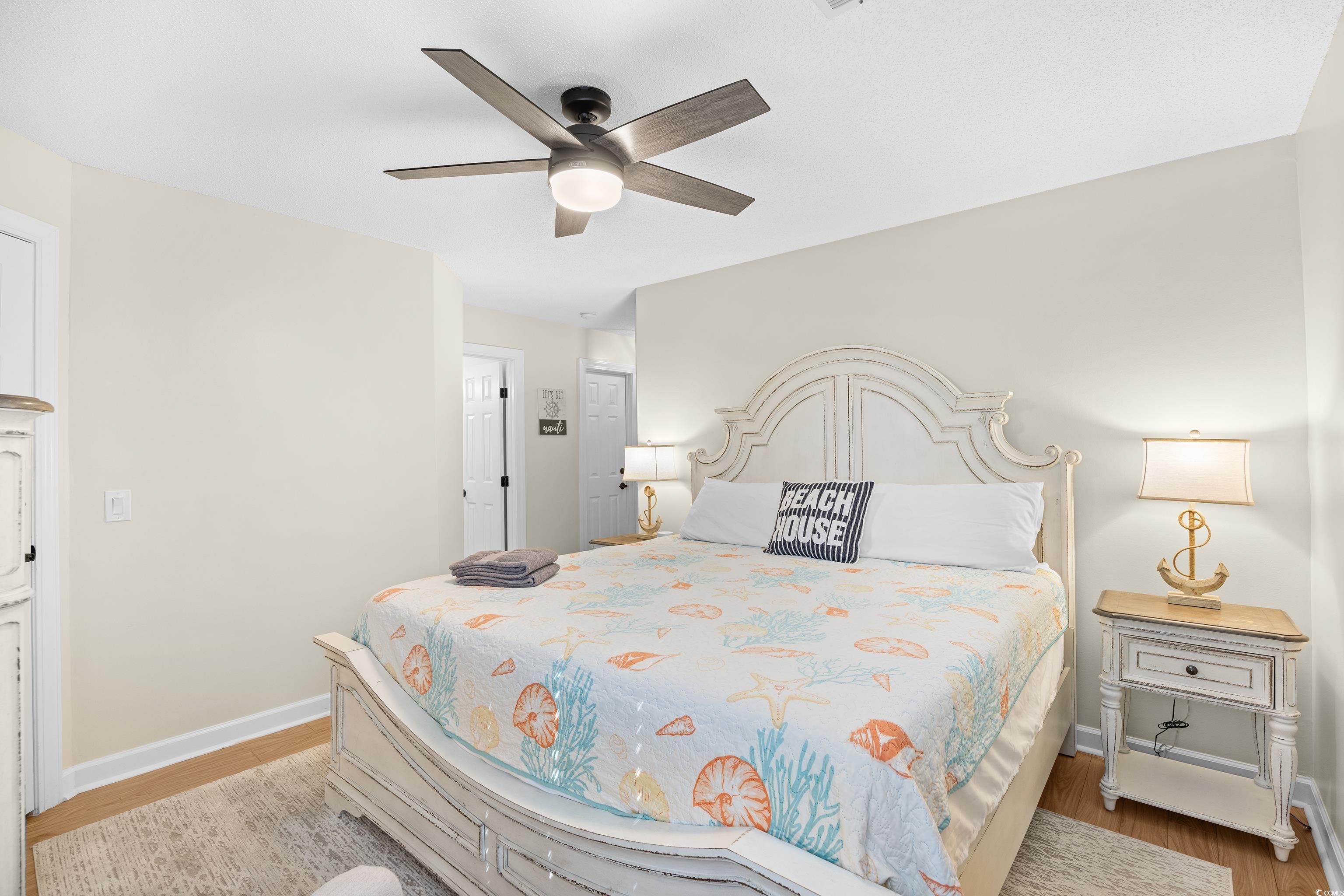 4277 Santolina Way, Unit D Murrells Inlet, SC 29576 - Photo 22 of 40 Bedroom with wood finished floors and ceiling fan