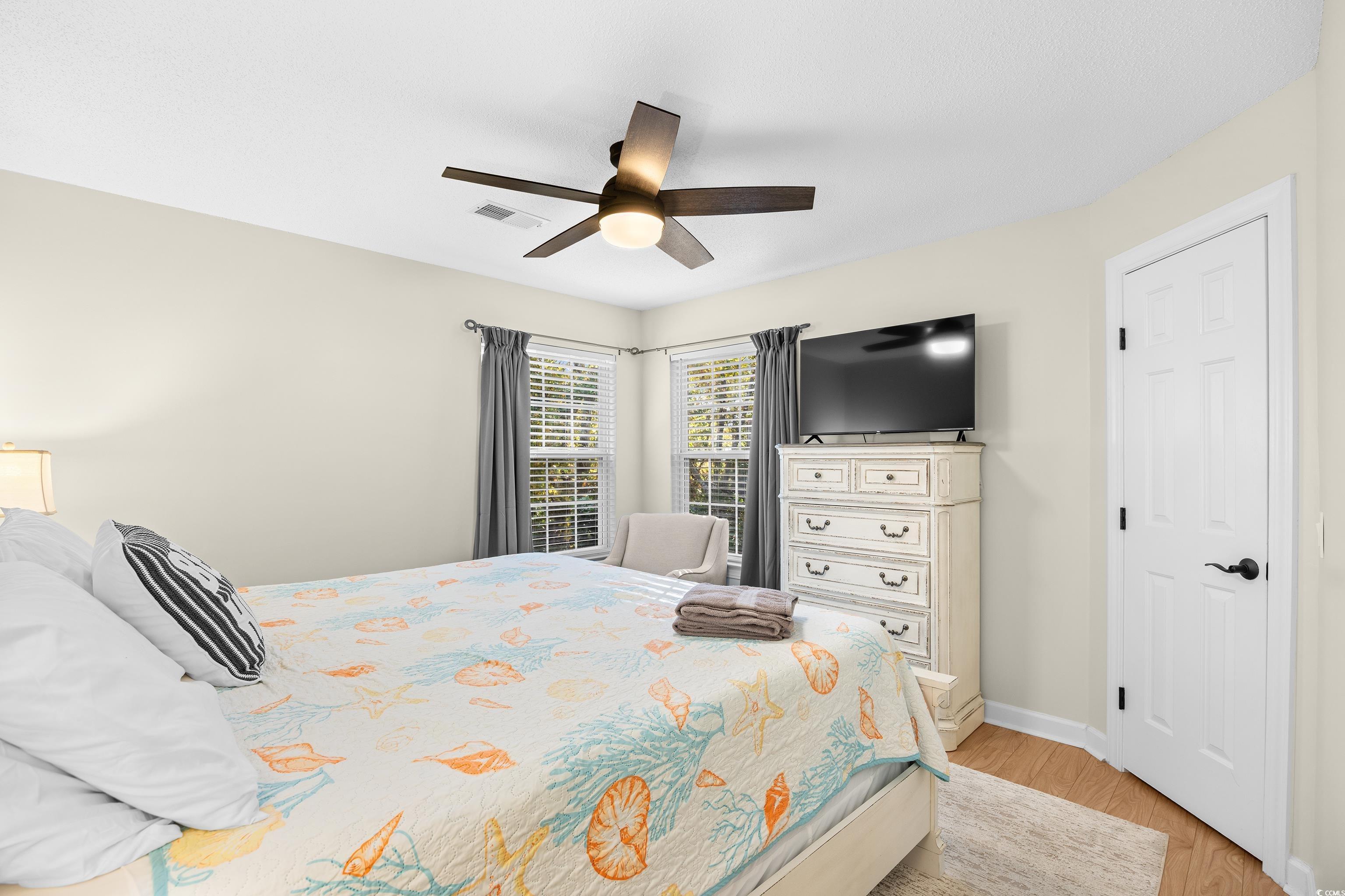 4277 Santolina Way, Unit D Murrells Inlet, SC 29576 - Photo 23 of 40 Bedroom with a ceiling fan and light wood finished floors