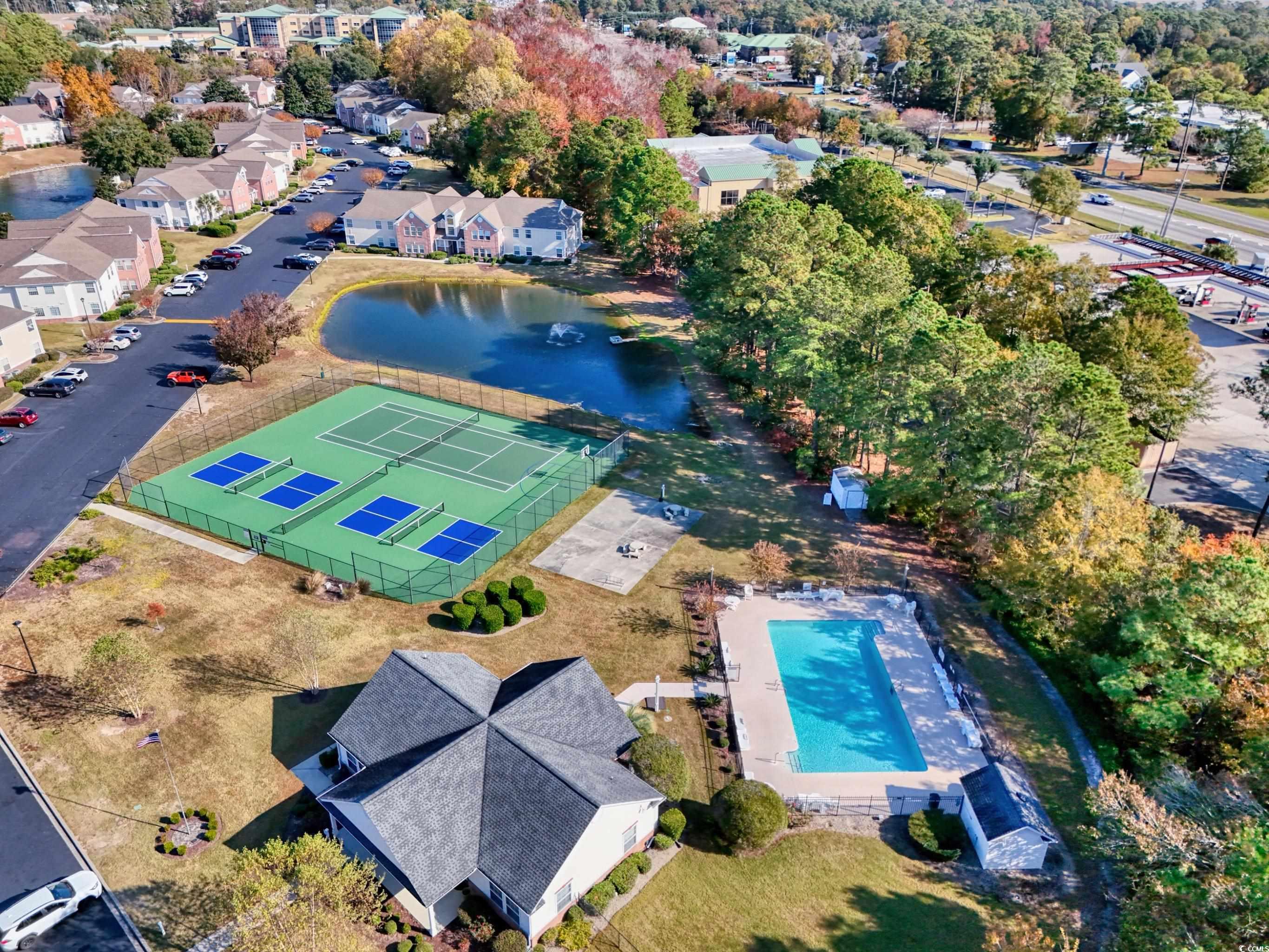 4277 Santolina Way, Unit D Murrells Inlet, SC 29576 - Photo 33 of 40 Aerial view of residential area with a nearby body of water and a pool