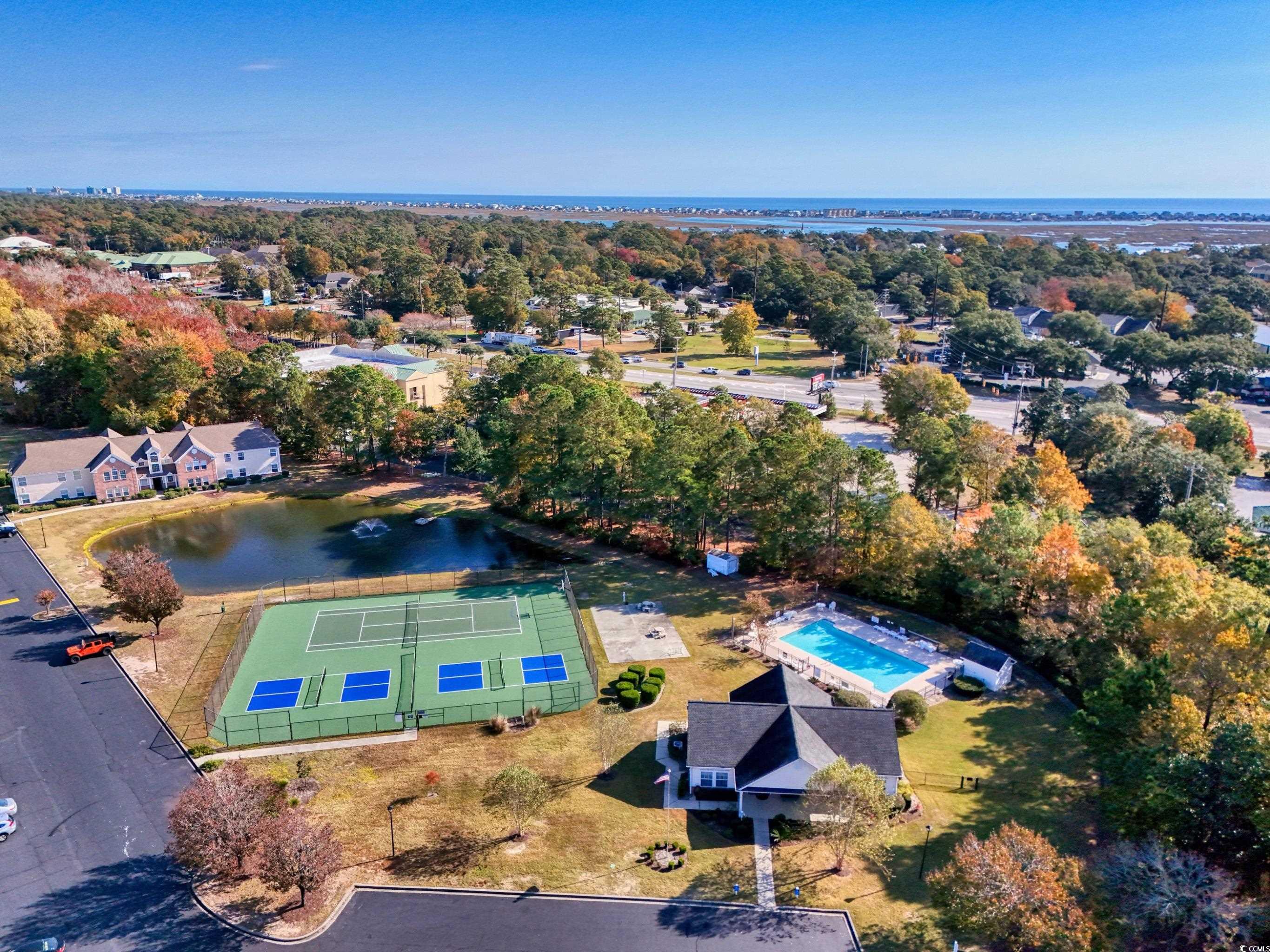 4277 Santolina Way, Unit D Murrells Inlet, SC 29576 - Photo 34 of 40 Bird's eye view of a nearby body of water and a pool area