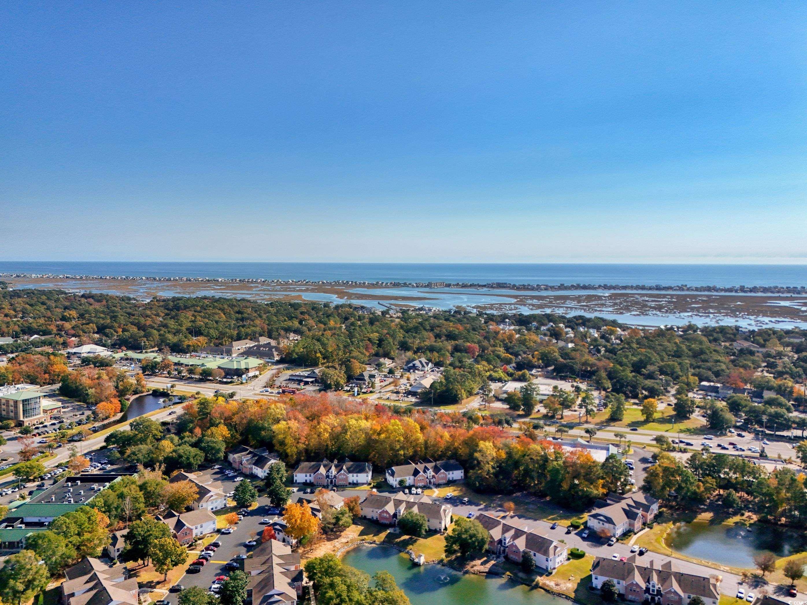 4277 Santolina Way, Unit D Murrells Inlet, SC 29576 - Photo 38 of 40 Aerial view of property and surrounding area featuring a nearby body of water and nearby suburban area