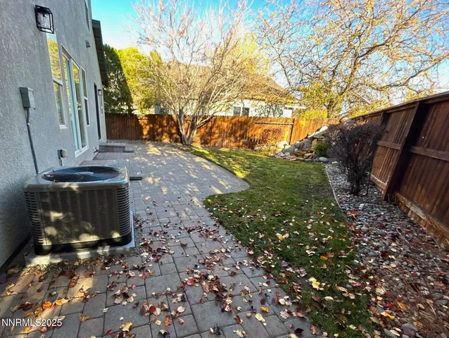 a view of a backyard of the house