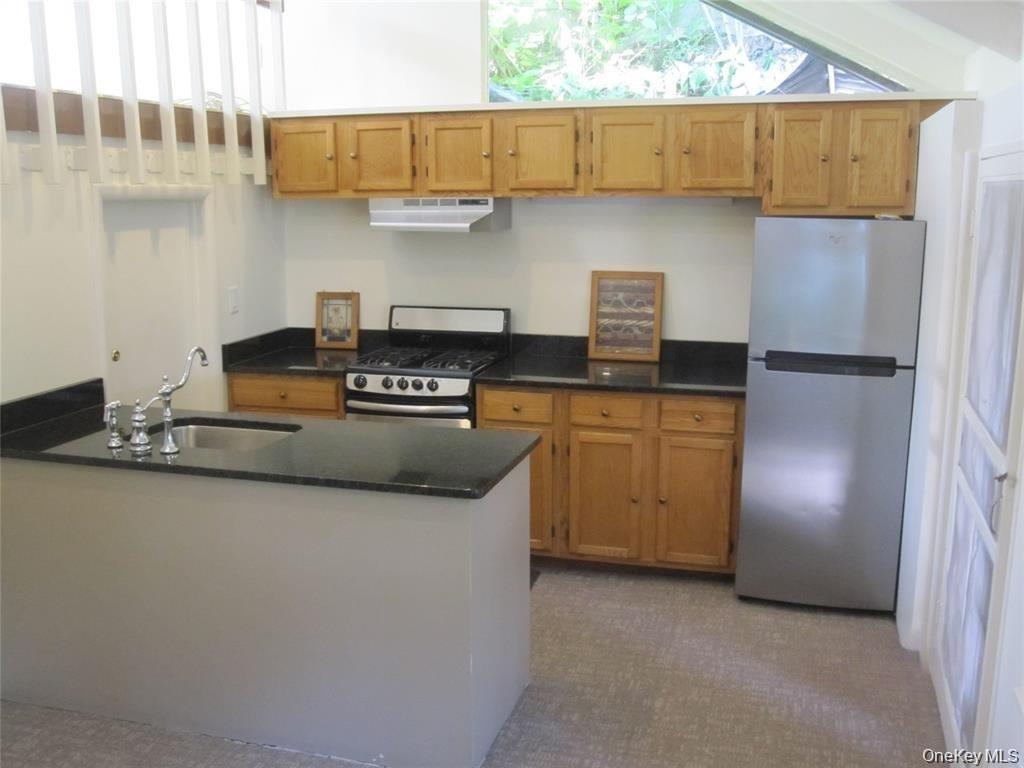 909 Rte 9W Nyack, NY 10960 - Photo 3 of 17 Sunny kitchen with granite counters, dishwasher, storage