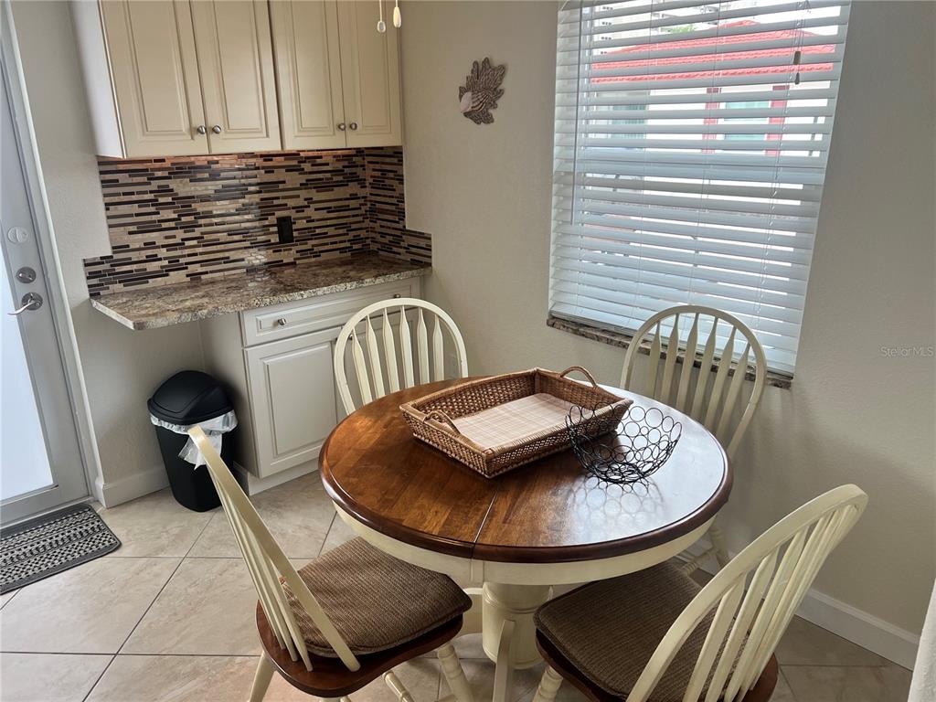 6154 Midnight Pass Road, Unit B07 Sarasota, FL 34242 - Photo 2 of 15 a table and chairs in a kitchen