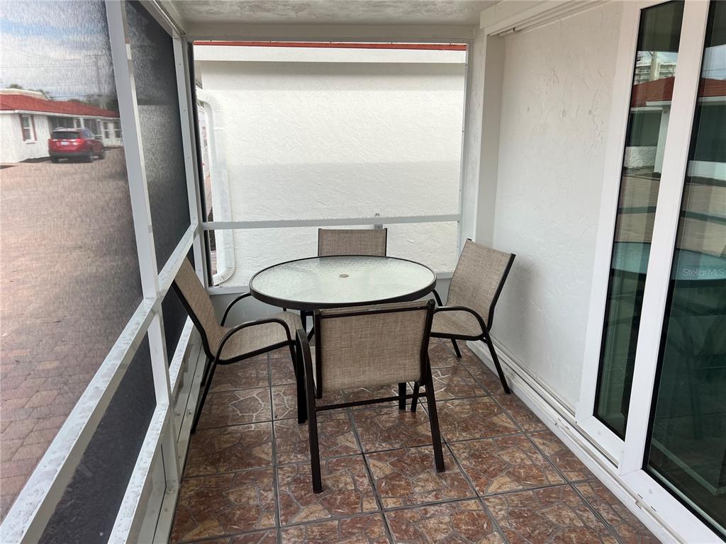 6154 Midnight Pass Road, Unit B07 Sarasota, FL 34242 - Photo 5 of 15 a view of a hallway with furniture and a gate