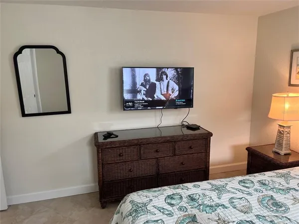 a bedroom with a bed and dresser