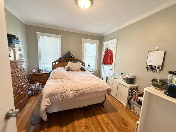 a bedroom with a bed and a cabinets