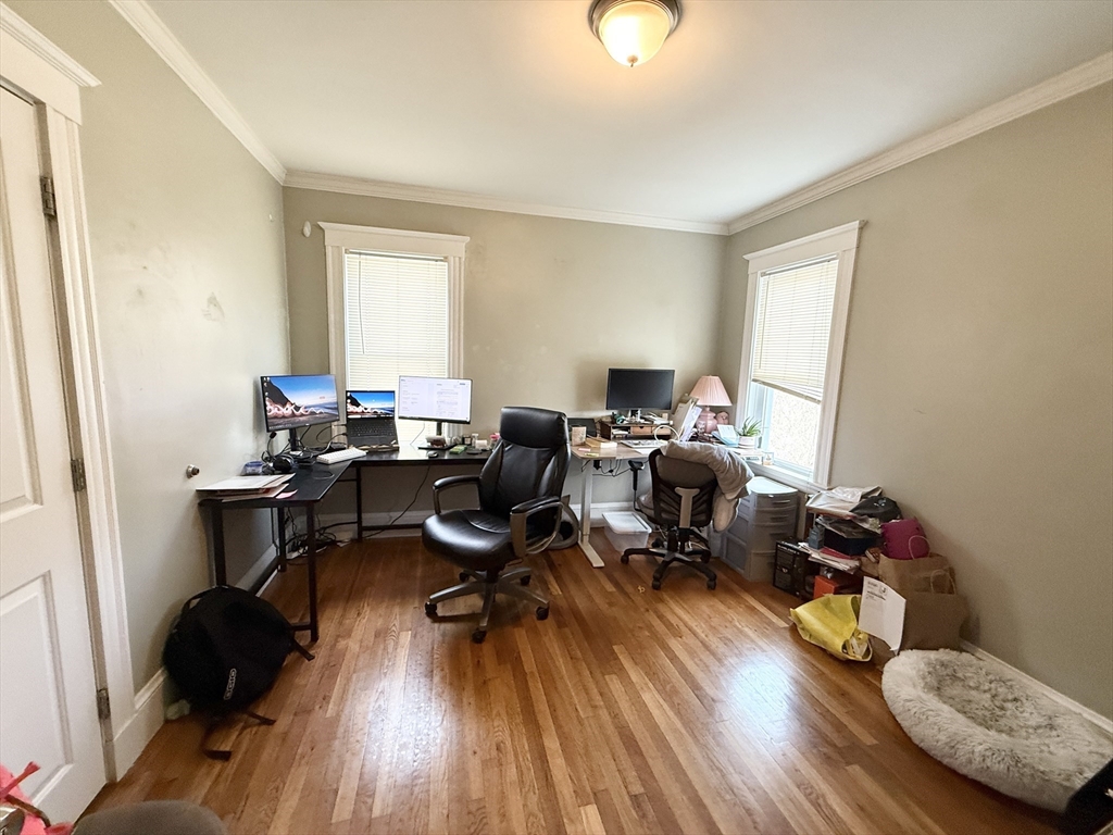 81 Florence Street, Unit 2 Boston, MA 02131 - Photo 7 of 11 a living room with furniture and a wooden floor