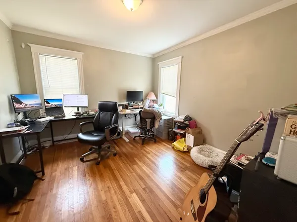 a workspace with furniture hardwood and a window