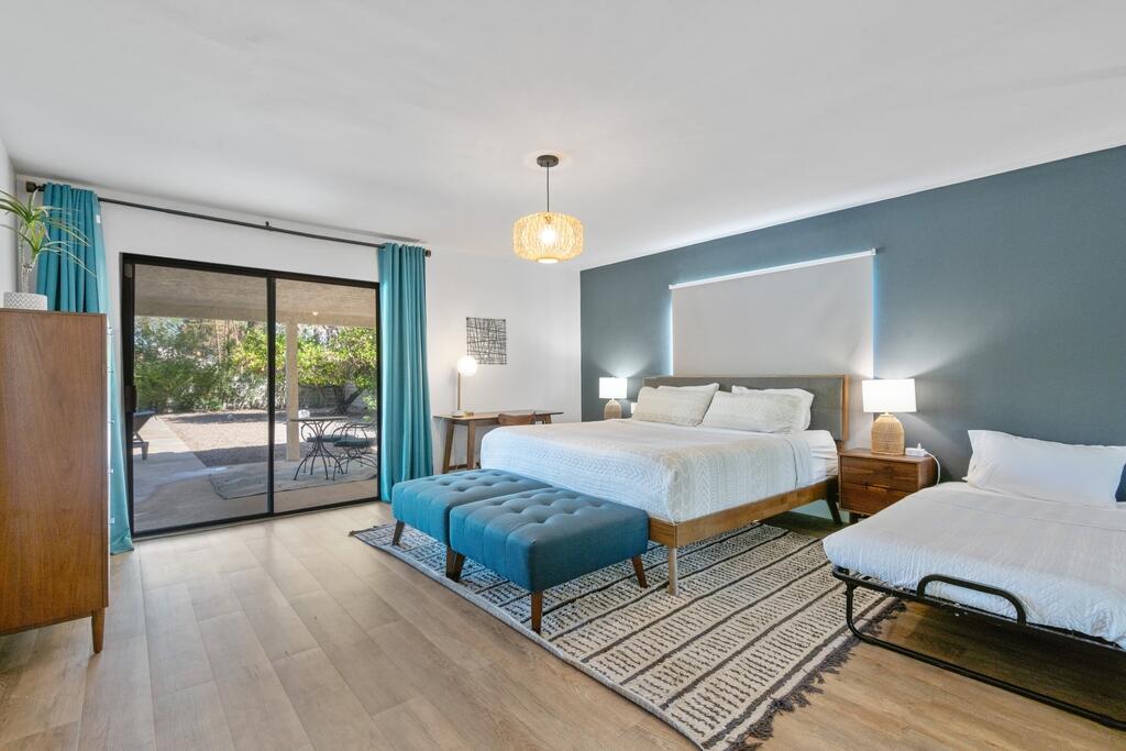 3060 East Verona Road Palm Springs, CA 92262 - Photo 15 of 33 a bedroom with a bed and a large window