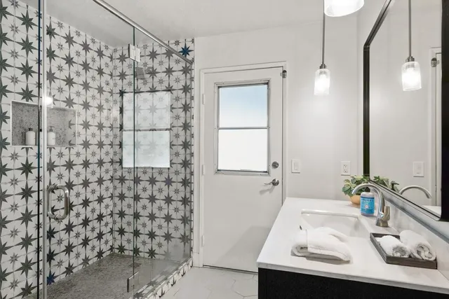 a bed room with a bed and a painting on the wall