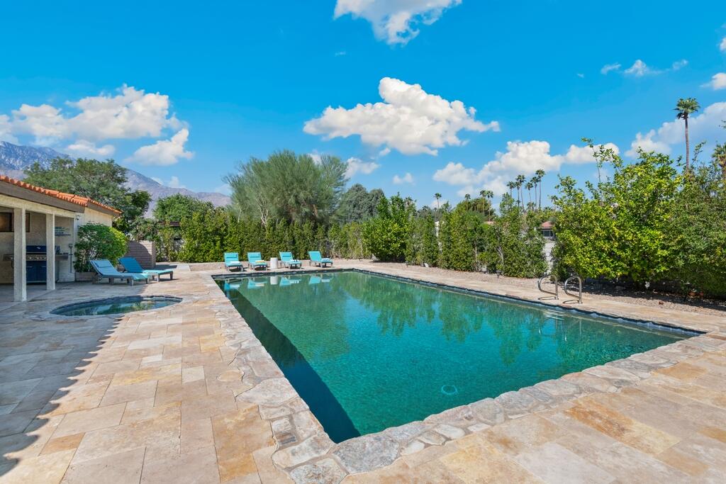 3060 East Verona Road Palm Springs, CA 92262 - Photo 23 of 33 a view of a swimming pool with a yard